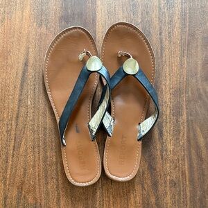 Report Sammy Black and Gold Flip Flop Sandals